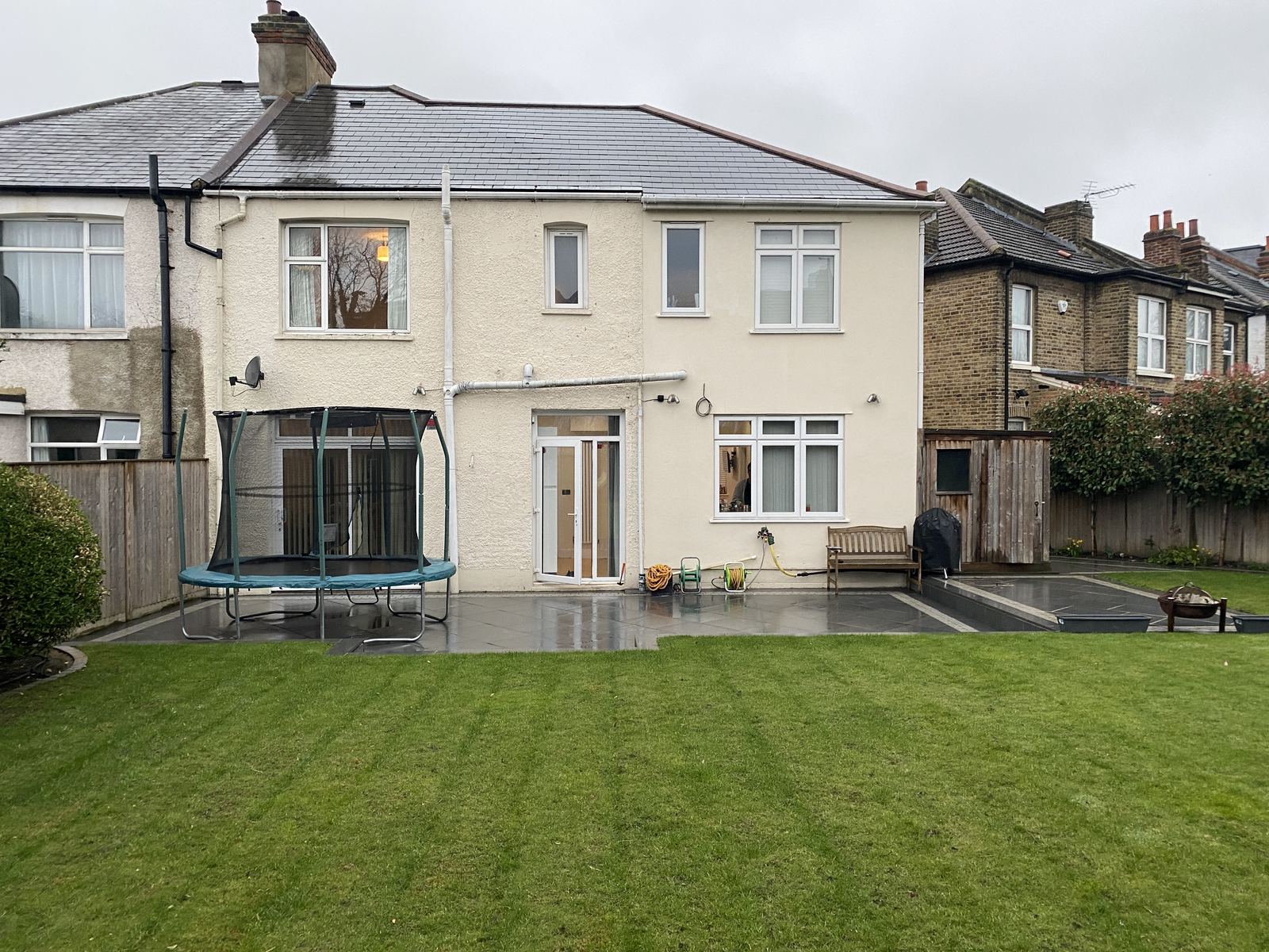 The rear of the house before the work, with the garden beyond