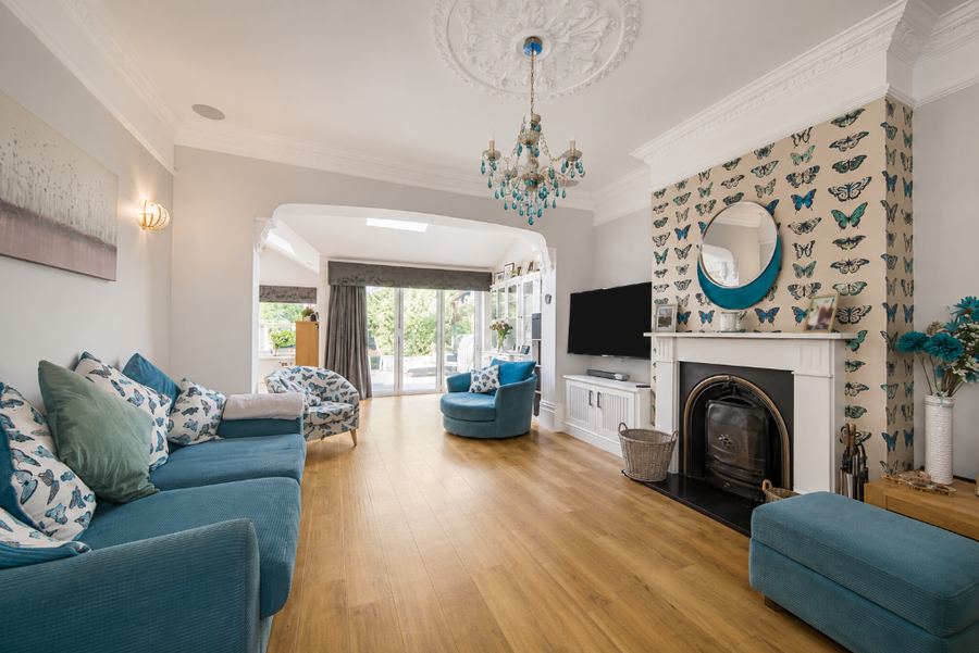 The room that became the dining room, as the house was marketed, laid out as a living room looking through to the rear
