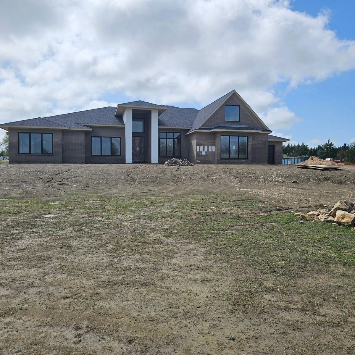 The front of the house during construction, brickwork complete and grounds not yet landscaped
