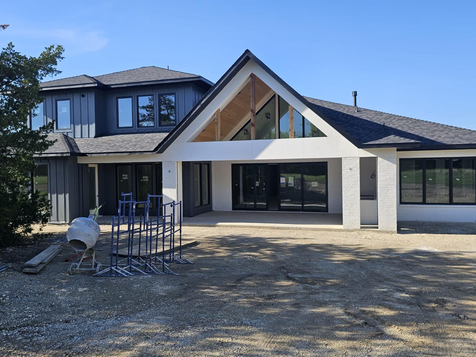 The garden elevation during construction, with the gable framed and glazing installed
